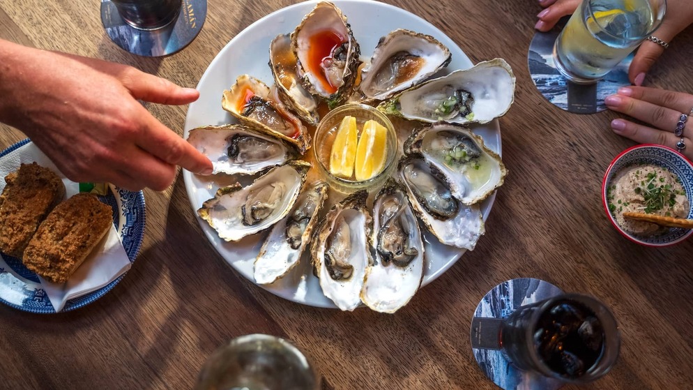 Fresh oysters served at Nancy's Bar in County Donegal, accompanied by lemon wedges and traditional Irish fare.