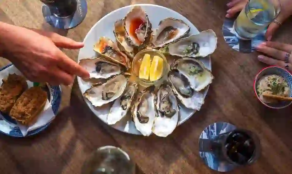 Fresh oysters served at Nancy's Bar in County Donegal, accompanied by lemon wedges and traditional Irish fare.