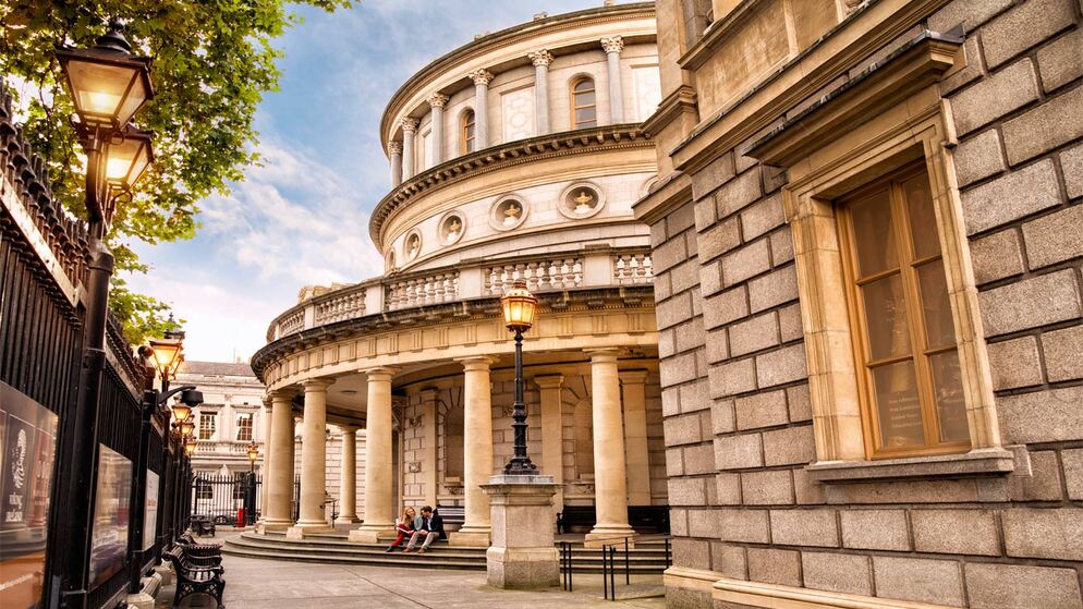 Front view of the National Museum of Ireland – Archaeology in Dublin with columns and lampposts.