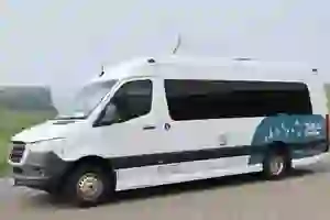 A white shuttle bus used to explore the cliffs of Moher